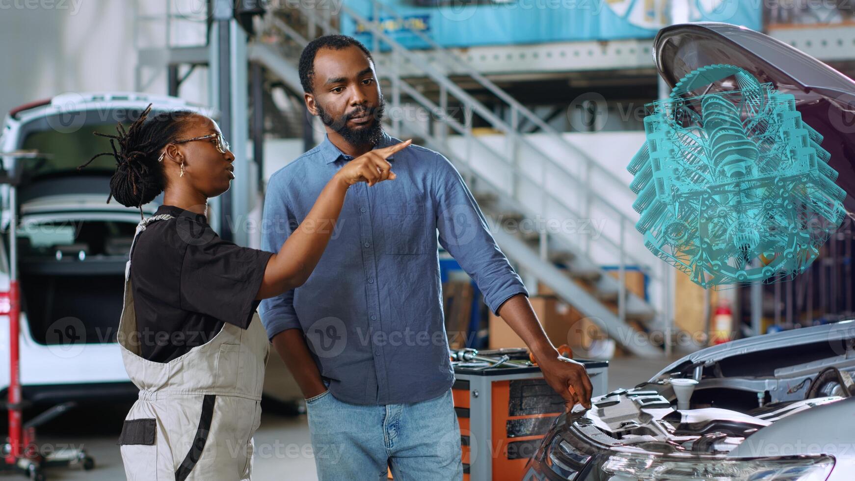 Trained serviceman in repair shop using holographic augmented reality to show woman defective components inside car. Seasoned garage professional using advanced AR software to project vehicle parts photo