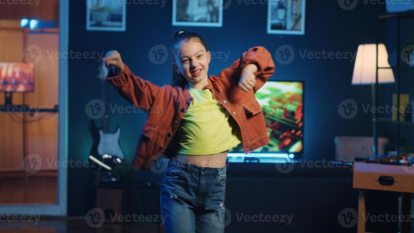 Children content creator using professional recording equipment to film dancing video for online streaming platforms. Young media star does viral choreography for her generation z fanbase photo