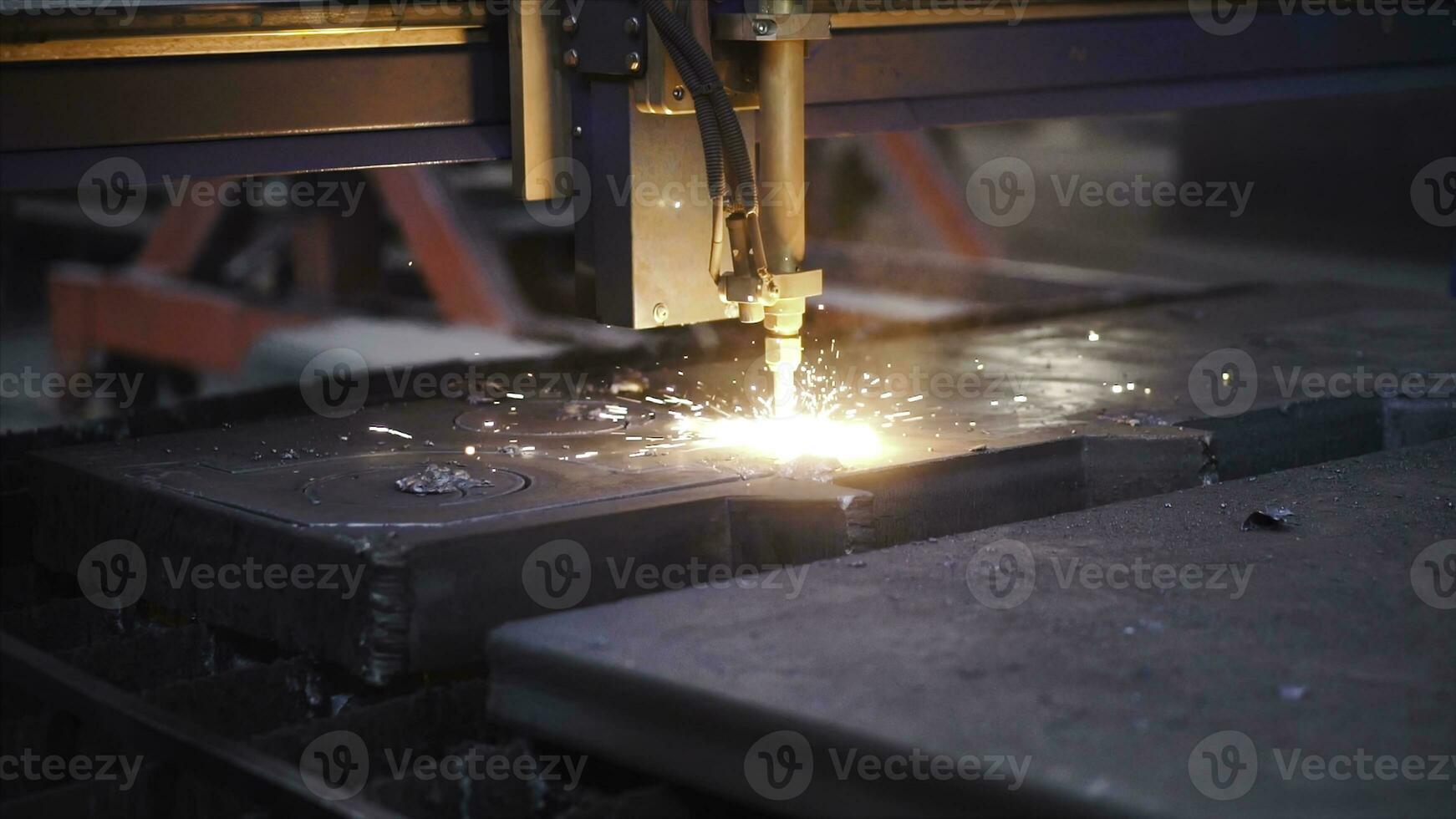 Welding patterns on metal in factory. Clip. Automated machine for welding seams in factory. Factory machine for creating patterns on metal by welding photo