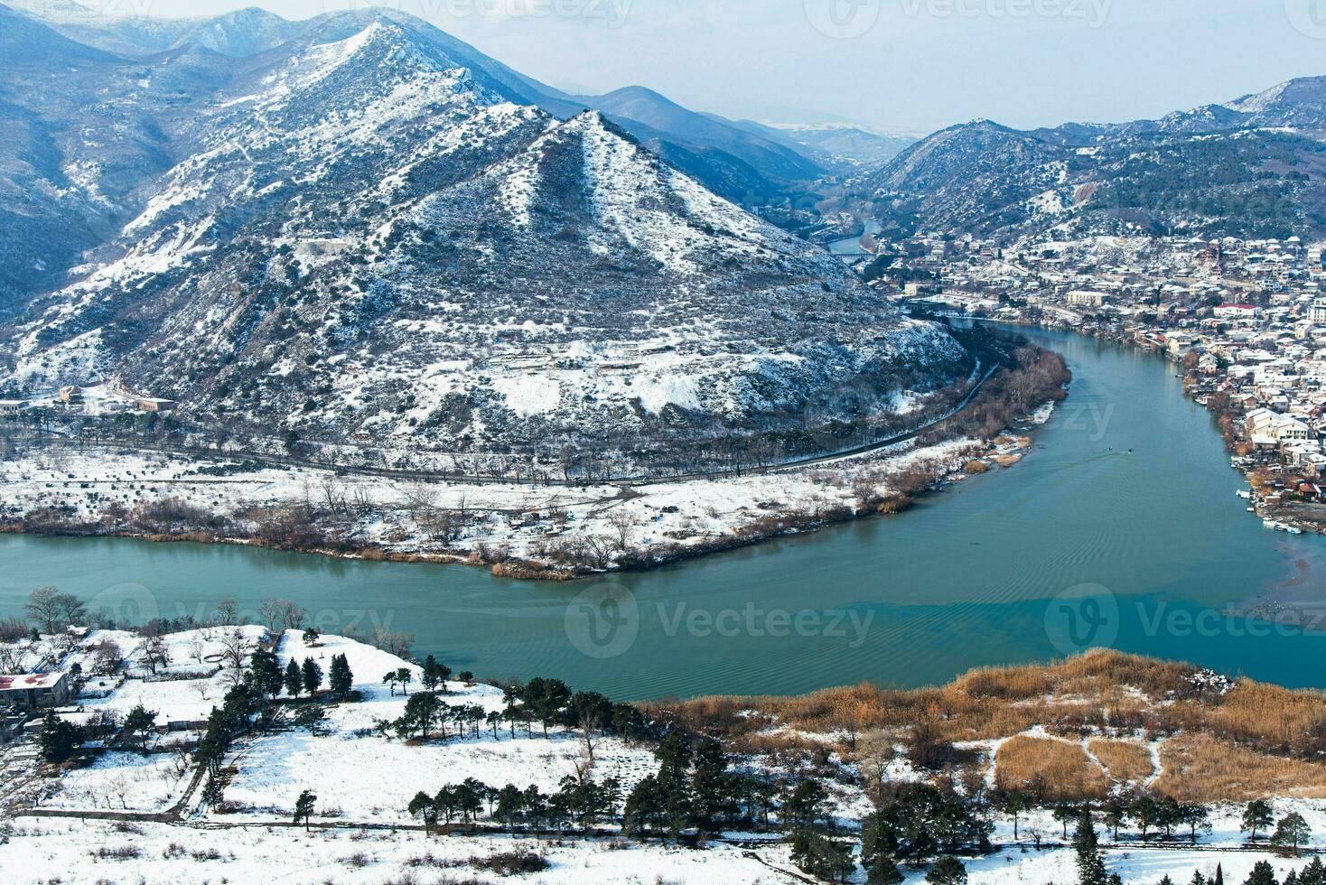 Jvari Monastery is one of the most famous place in Georgia. Top view of with Mtskheta town and the confluence of the Mtkvari and Aragvi rivers. photo