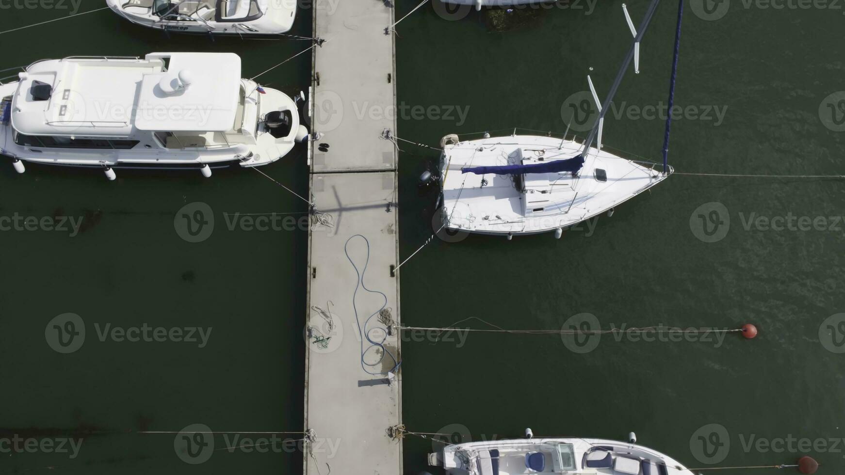 Sailboats moored in the port, a lot of beautiful yachts. Top view on Yachts and boats moored in the port photo