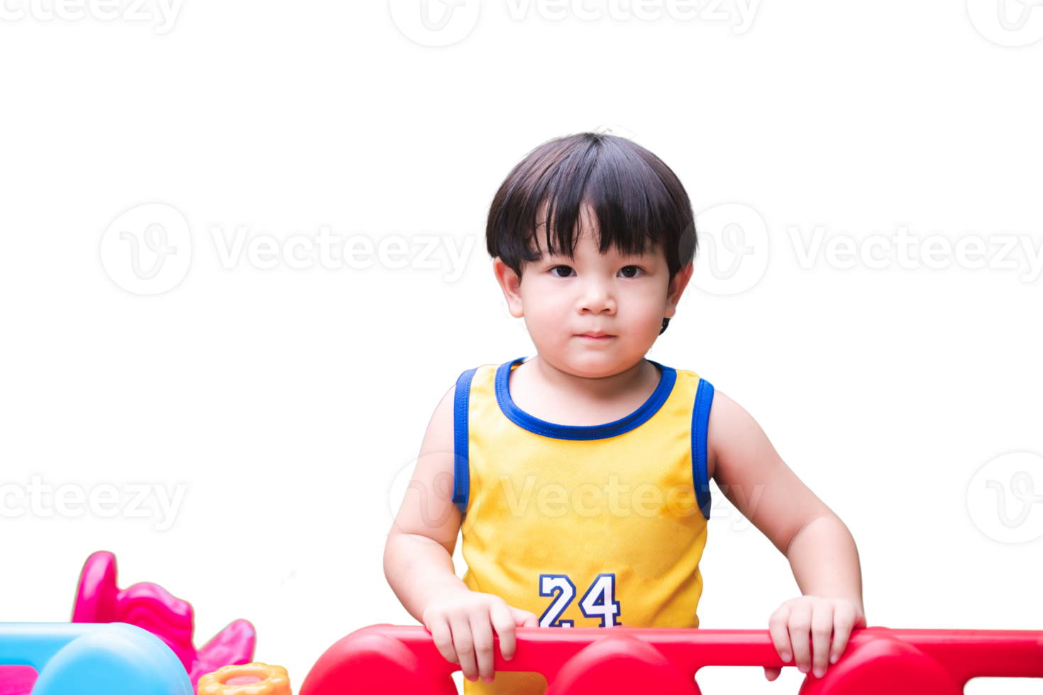 Young Child Playing on Colorful Playground. Asian toddler Boy in a yellow jersey enjoys playtime on a vibrant, colorful playground structure, isolated background. png