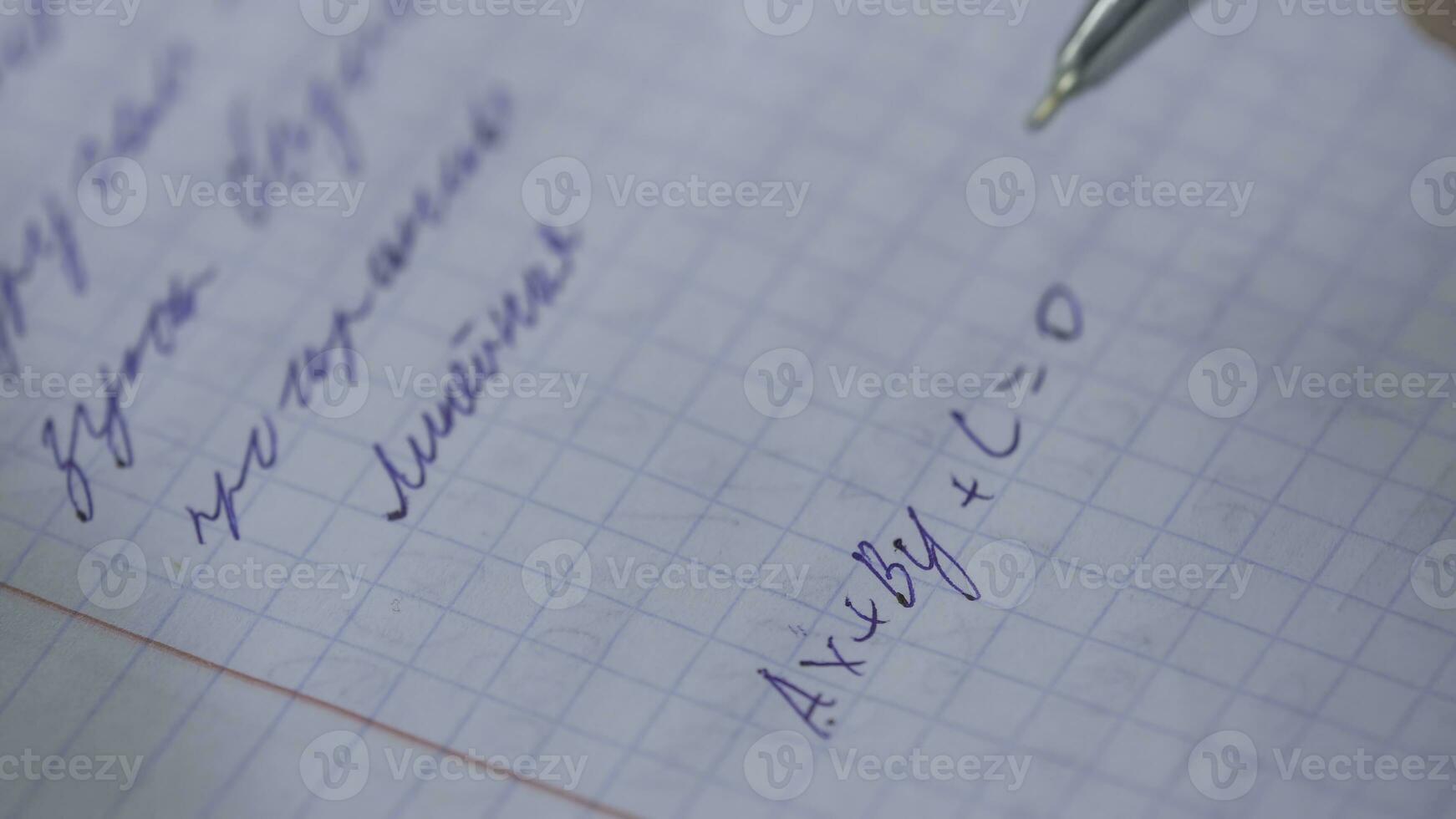 Mathematics, Equations close-up. Homework. Solving Mathematical Problem. Student solves the equation on paper photo