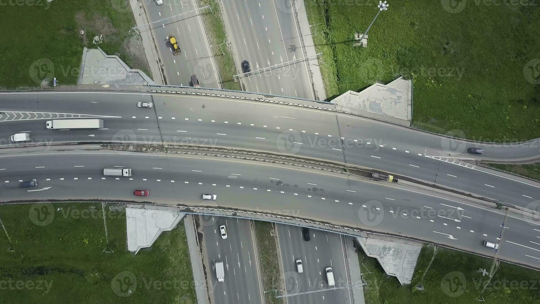 Elevated expressway. Clip. Top view at curves and lines of city highway. The curve of suspension bridge. Background scenic road photo