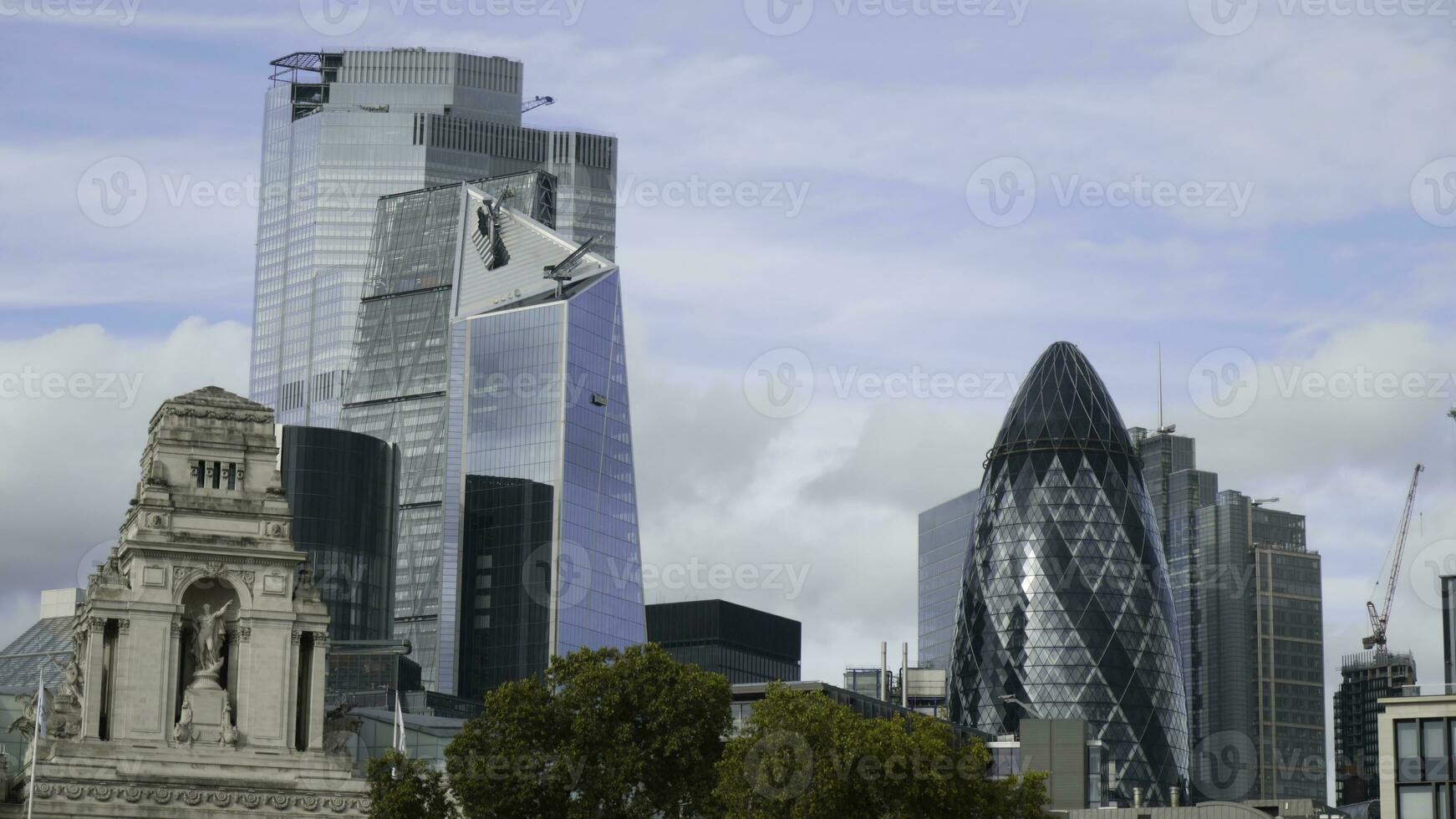 Old historic building on background of modern skyscrapers. Action. Contrast of architecture of buildings of different times in modern city photo