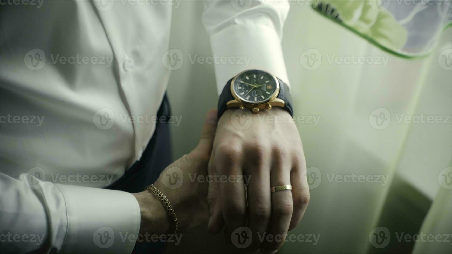 Closeup designer watch on businessman hand. Clip. Hand of businessman with a clock photo