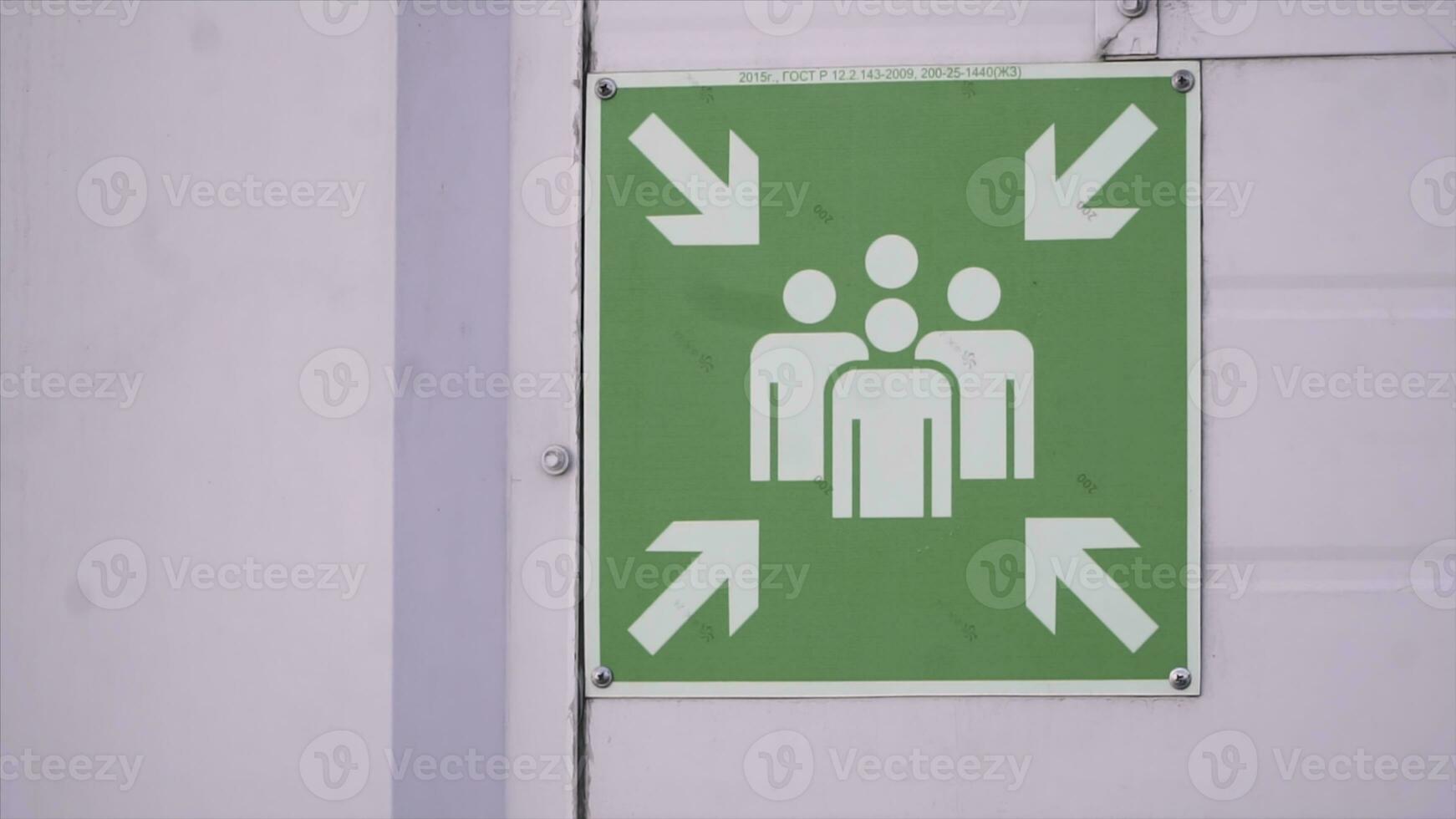 Green assembly point sign on white background. Meeting or assembly point sign. Clip. photo