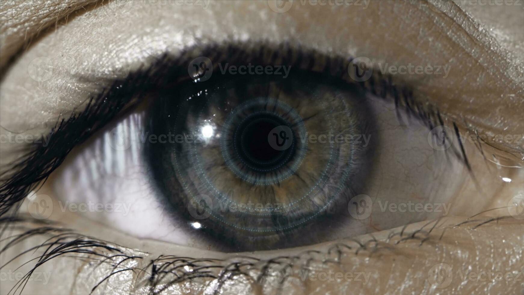 Technological lens on the eye. The concept of future technologies. Female eye with futuristic lens, macro photo