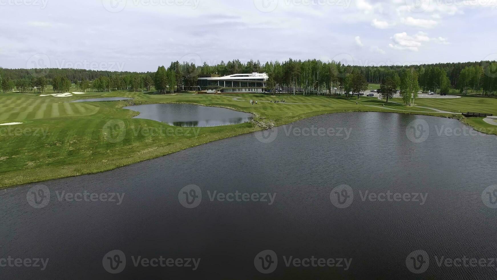 Solar Golf cart with clouds on blue sky and forest lake Golf club, aerial photo