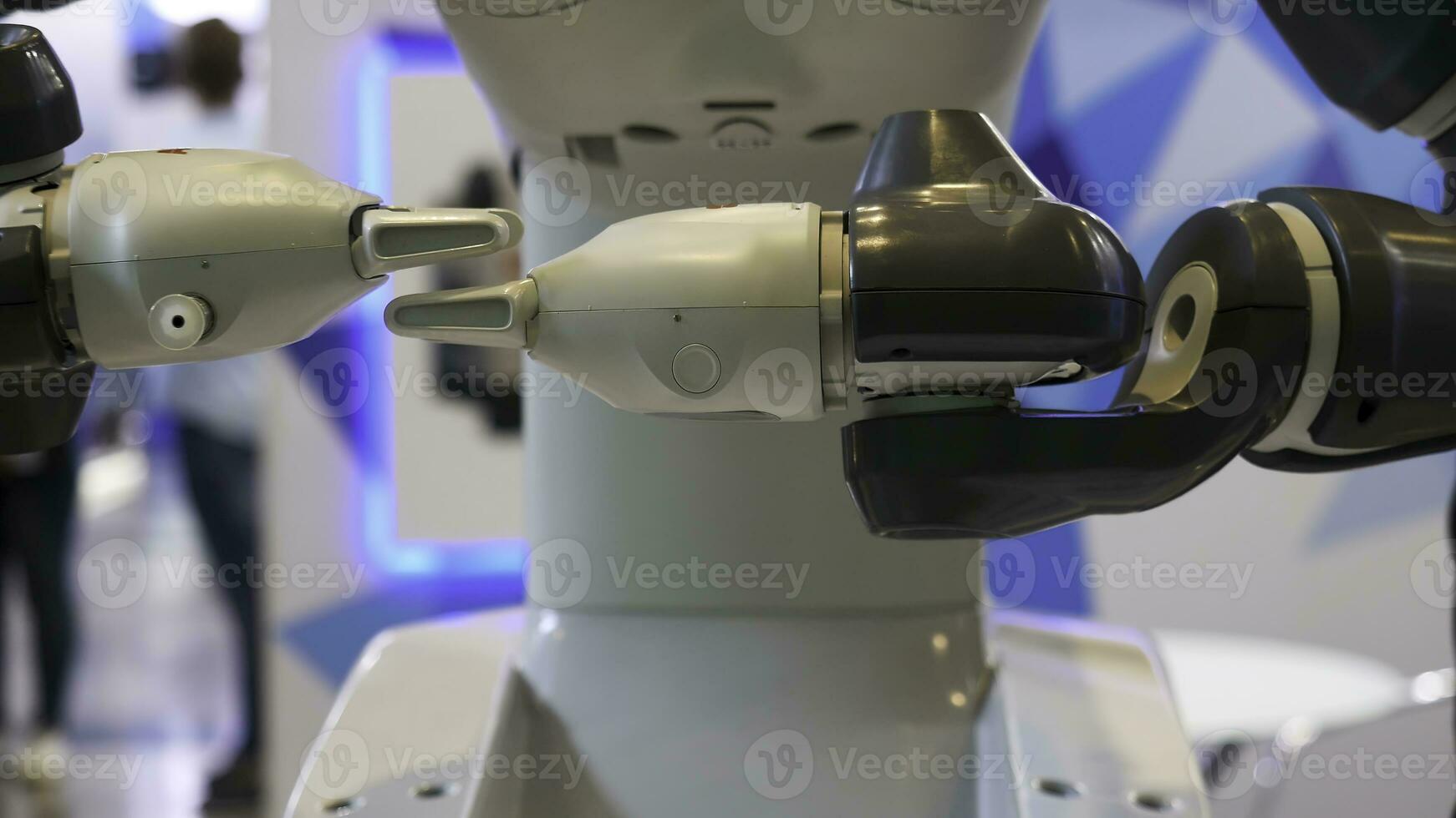 High technology, automated robot moving his hands at the EXPO, exhibition with the achievements of nations. Media. Close up for modern robot hands in motion. photo