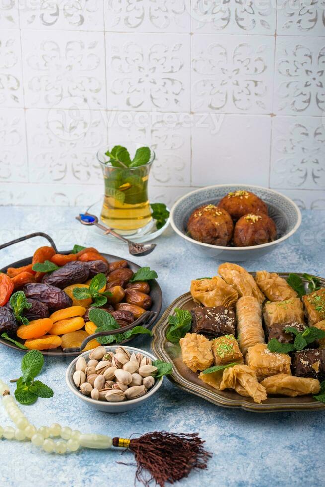 Ramadan iftar traditional desserts baklava and dates photo