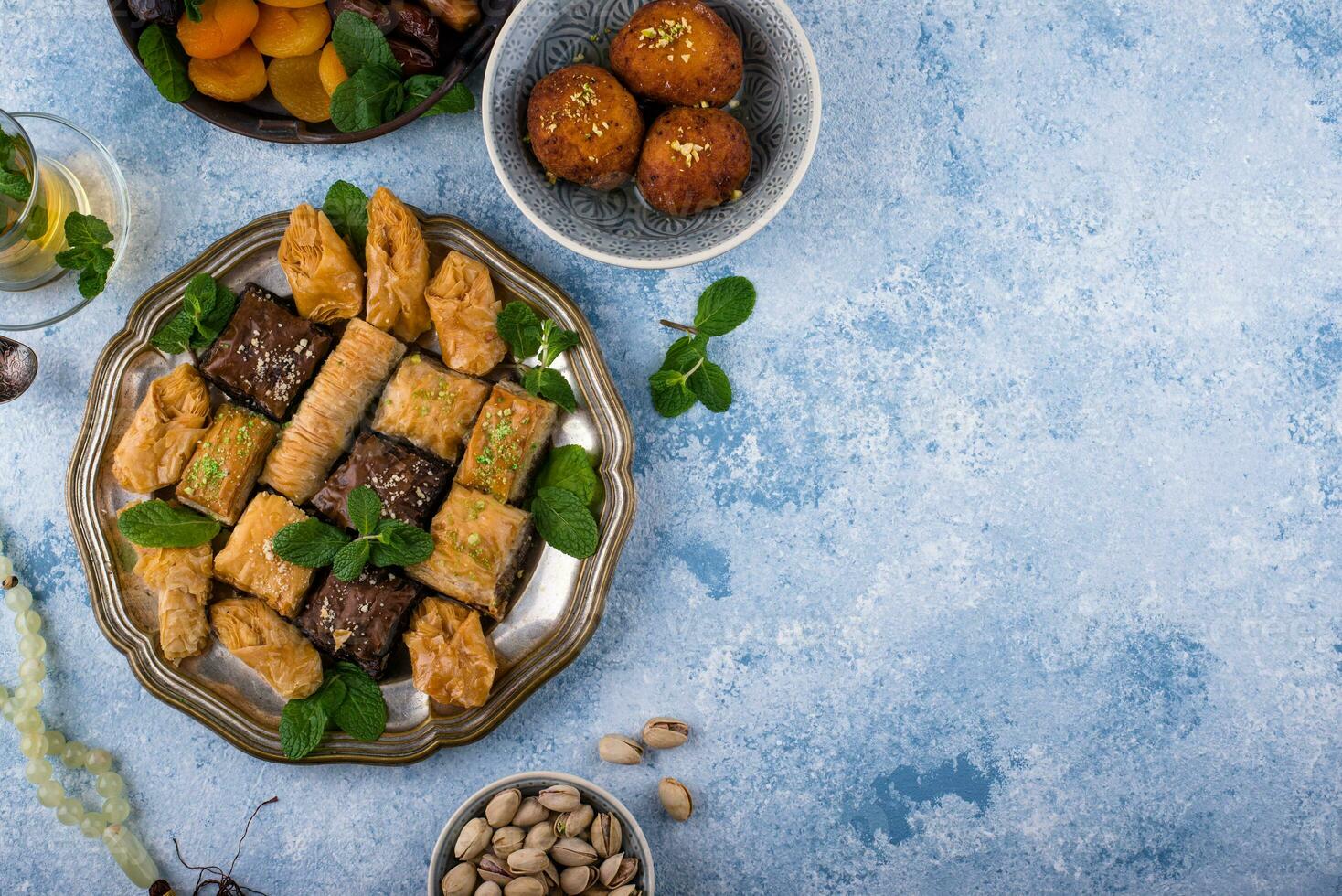 Ramadan iftar traditional desserts baklava and dates photo