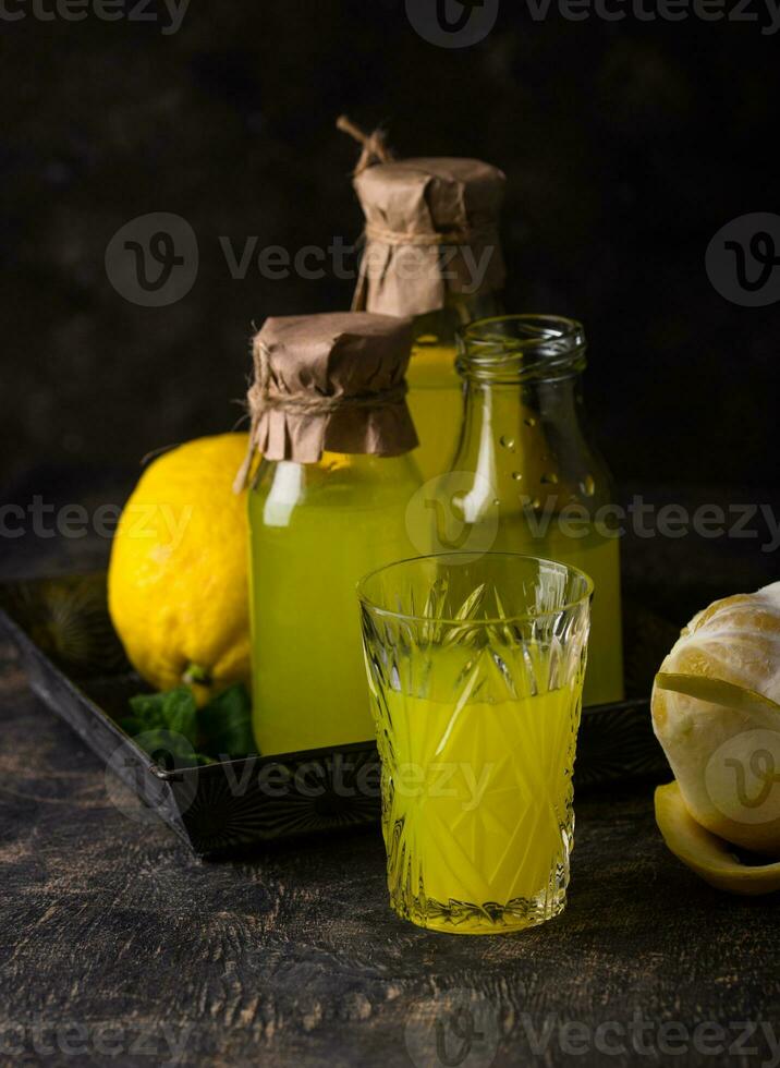 Traditional italian limoncello or lemon liquor photo