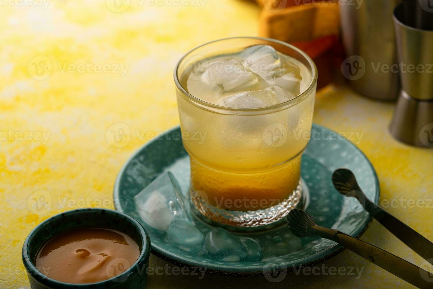 Summer cocktail with mango juice and ice photo