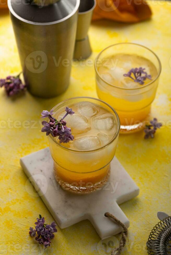 Summer cocktail with mango juice and ice photo