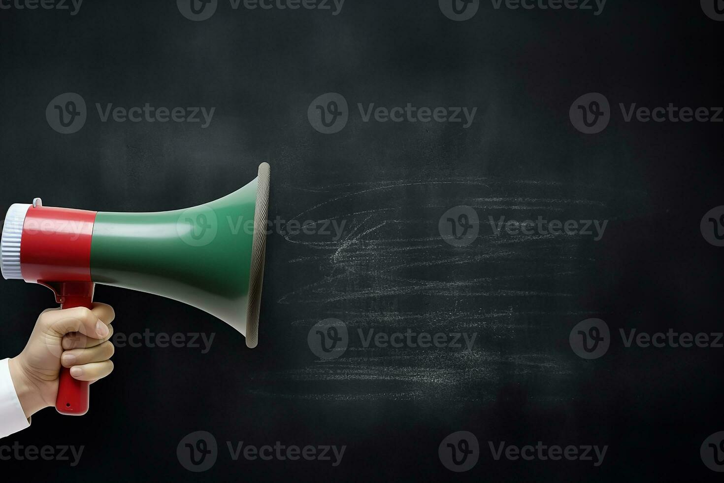 AI generated Hand holding megaphone over chalkboard background with copy space photo