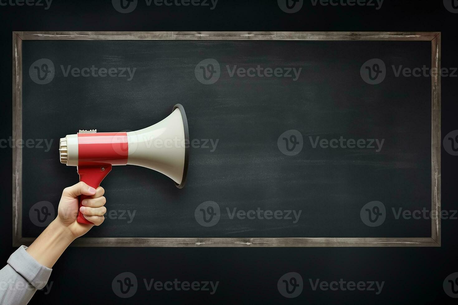 AI generated Hand holding megaphone over chalkboard background with copy space photo