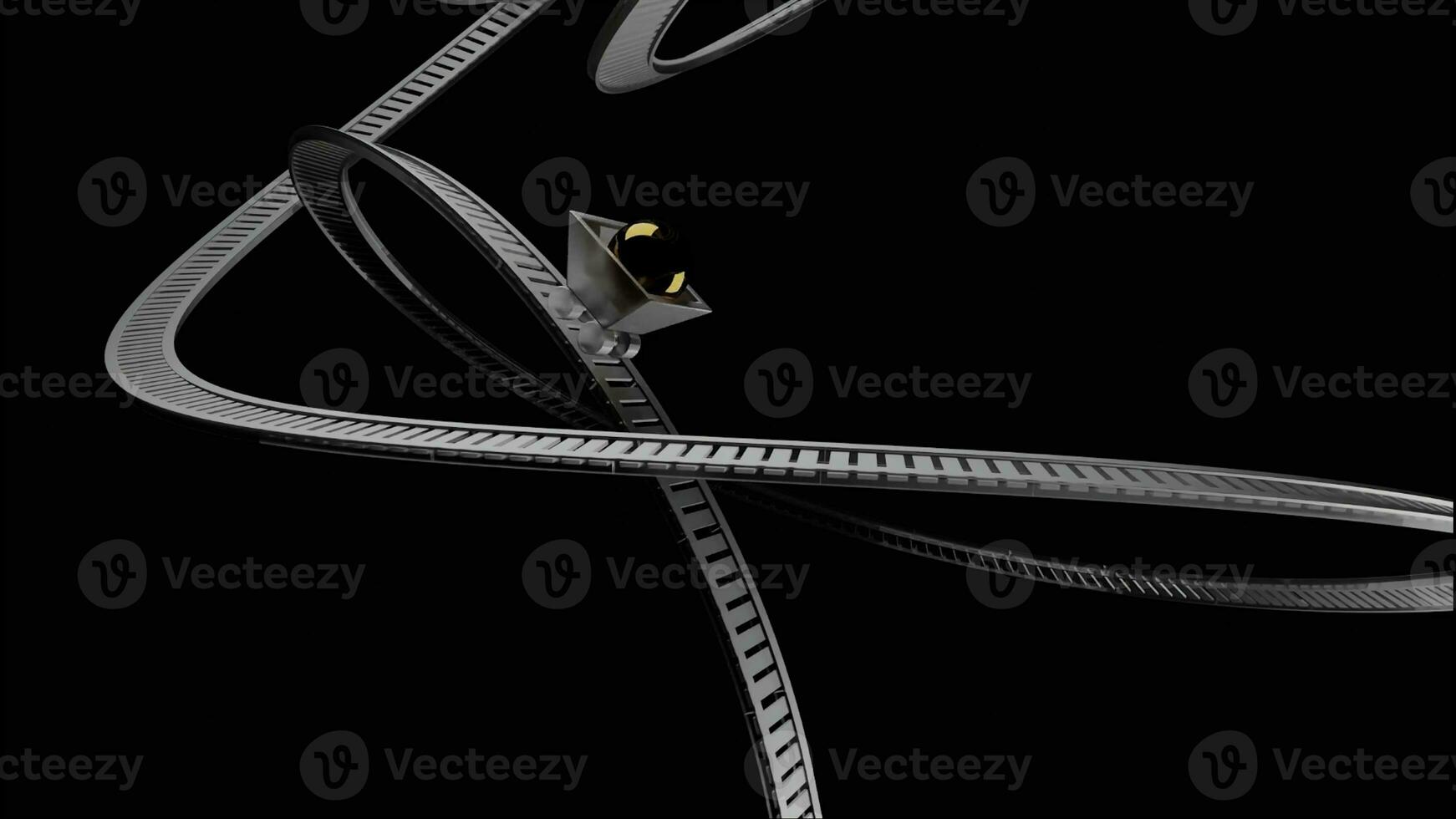 Abstract small silver cart with a brown sphere inside rolling on rails very fast. Design. Unusual small wagon with a glowing ball moving on bending rails isolated on a black background. photo