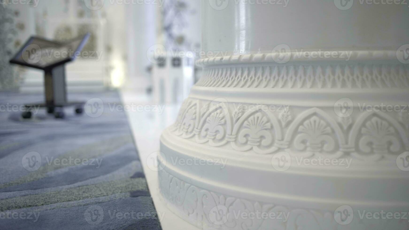 Interior of a white orthodox beautiful church. Scene. Close up view of the column with carved pattern. photo