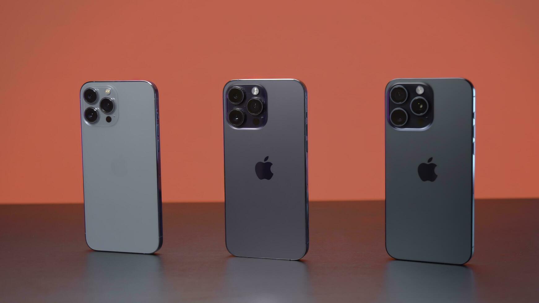 New York - September 15, 2023. iPhones of different generations in comparison. Action. Comparison of new iPhone 15 with versions 14 and 13 generations. Design of iPhones 13, 14 and 15 promax versions photo