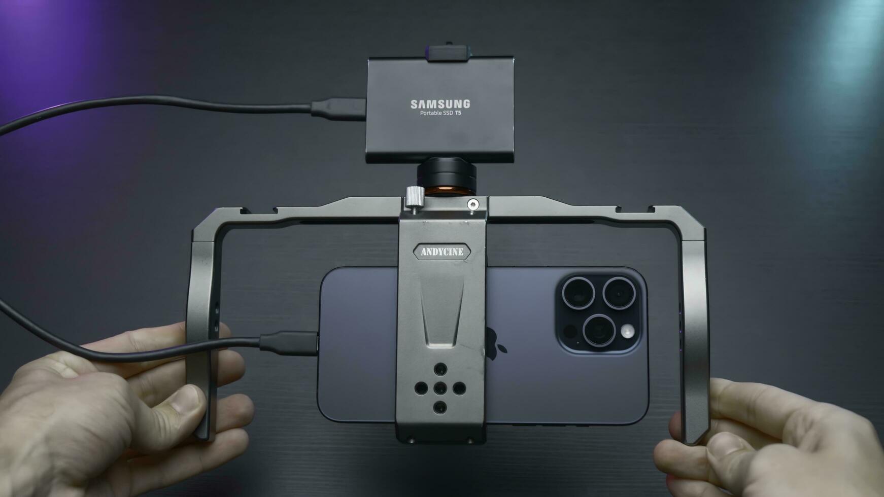China, Beijing - September 15, 2023. Holder for shooting with stabilization for phone. Action. Professional stabilizer for phone and video shooting. Samsung Stabilizer with new iPhone 15 pro for photo