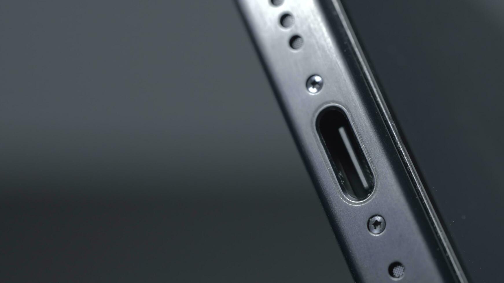 New York - September 15, 2023. Close-up of USB-C connector on iPhone. Action. Innovation in new iPhone 15 pro model with type C charging connector. New connector for iPhone 15 pro with stylish design photo