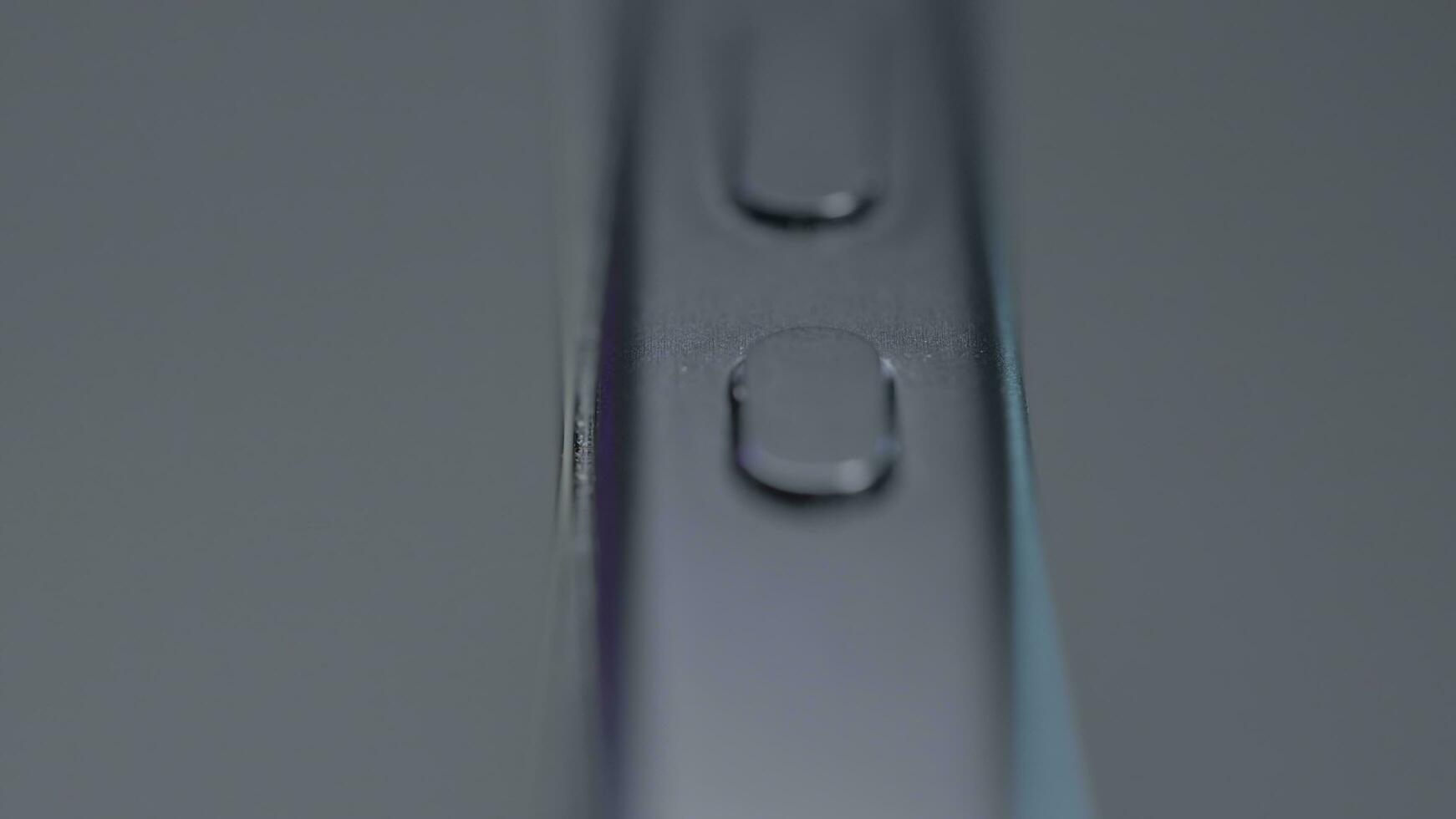 USA, New York - September 15, 2023. Close-up design of case of new iPhone. Action. Stylish design of new iPhone 15 pro max on isolated background. Button on side of new iPhone 15 pro photo