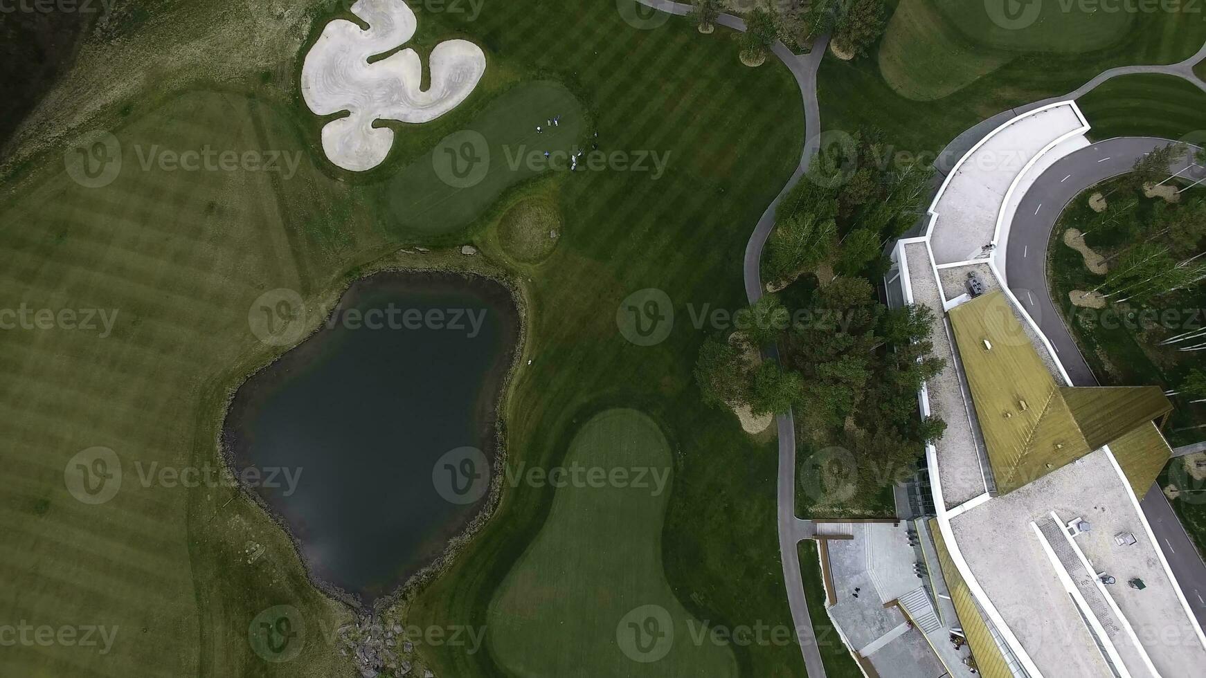 Top view green golf course outdoor green grass field. Aerial view from flying drone photo