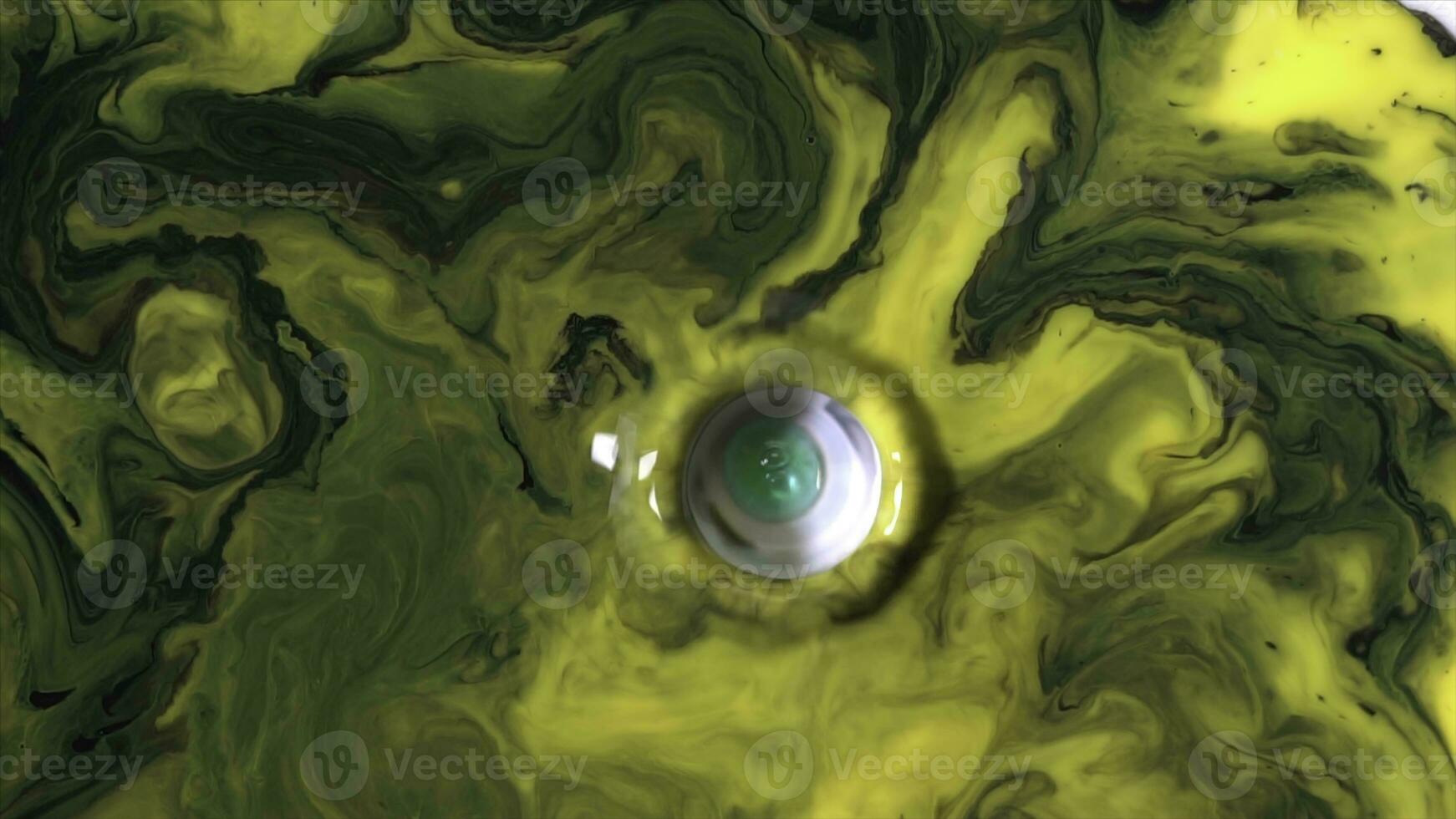 Beautiful reaction to the soap droplets added to yellow and green inks in milky substance. Colorful background of liquid paints moving on white surface. photo