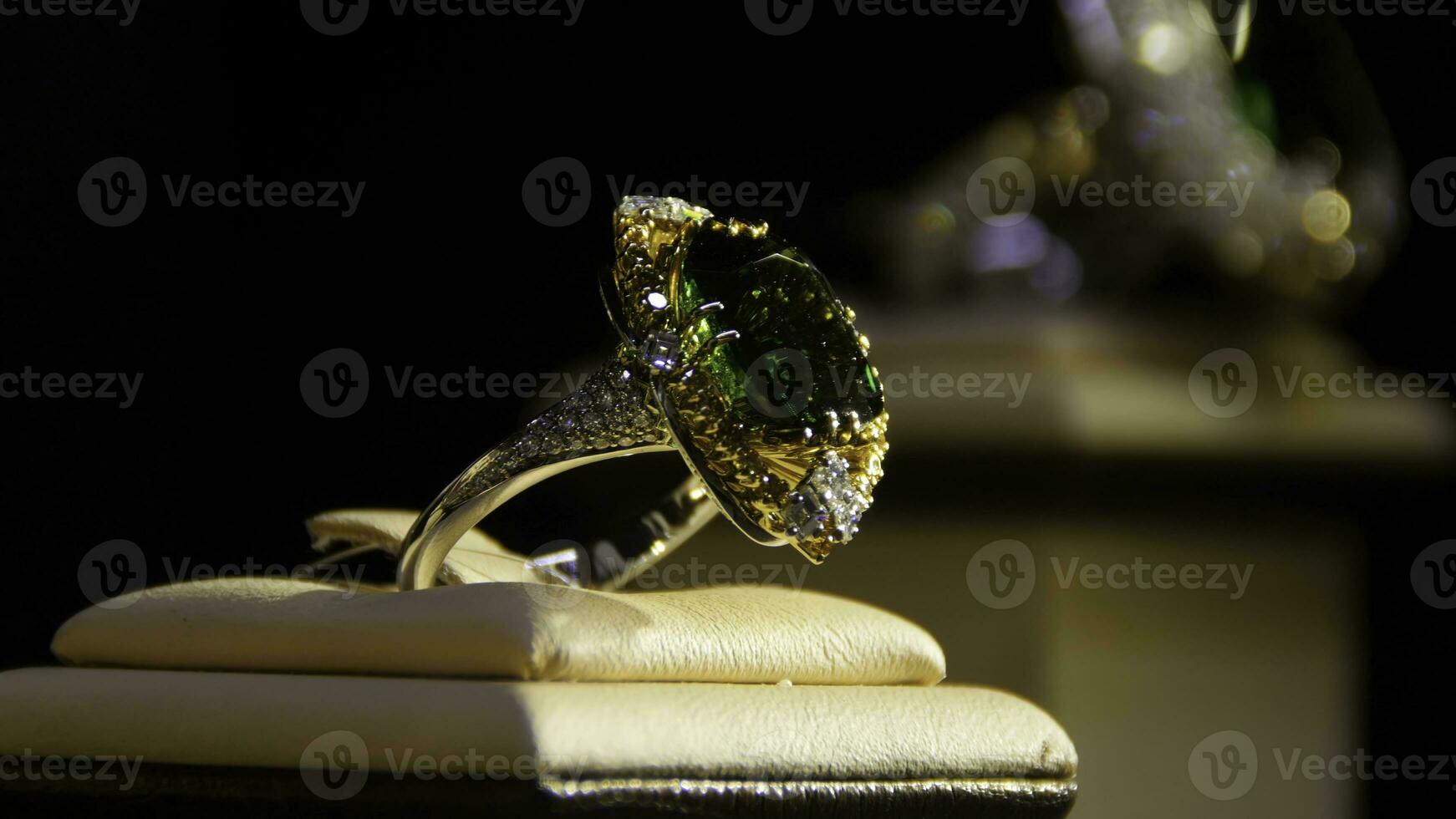 Jewelry with emeralds and diamond. Gemstones. Gold ring with emerald photo