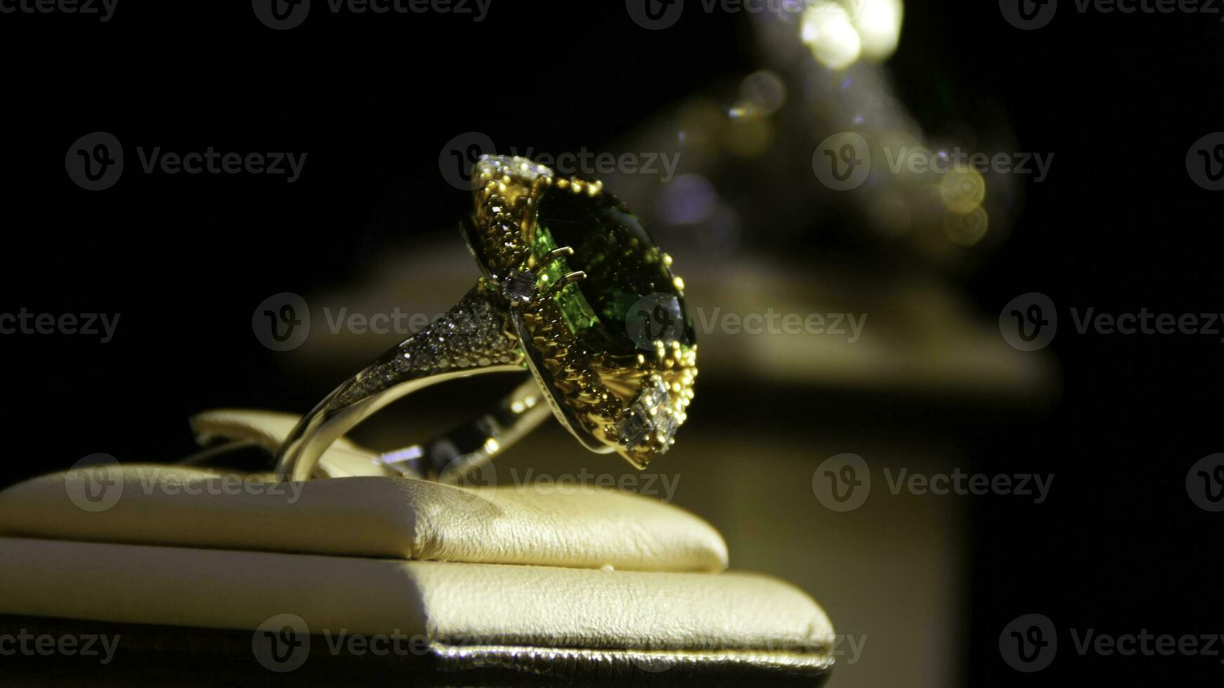 Jewelry with emeralds and diamond. Gemstones. Gold ring with emerald photo