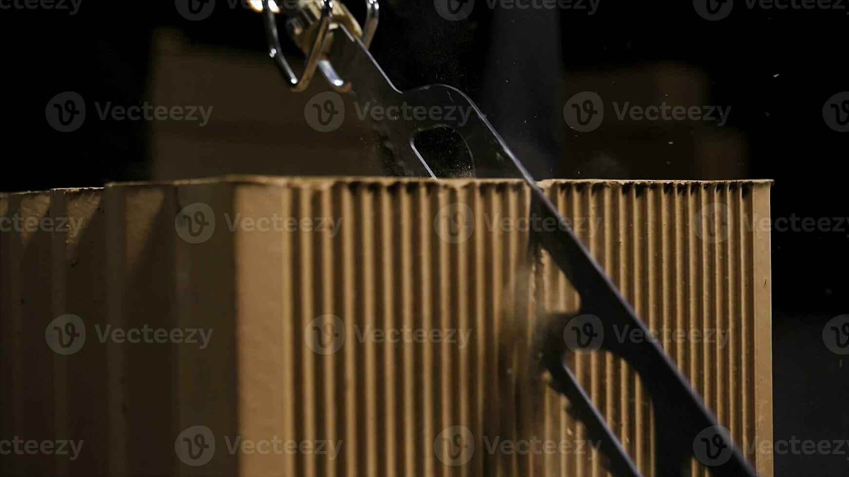 Close up of a worker using a block cutting automatic saw to prepare ceramic blocks for building process. Stock footage. Turned on small electric saw. photo