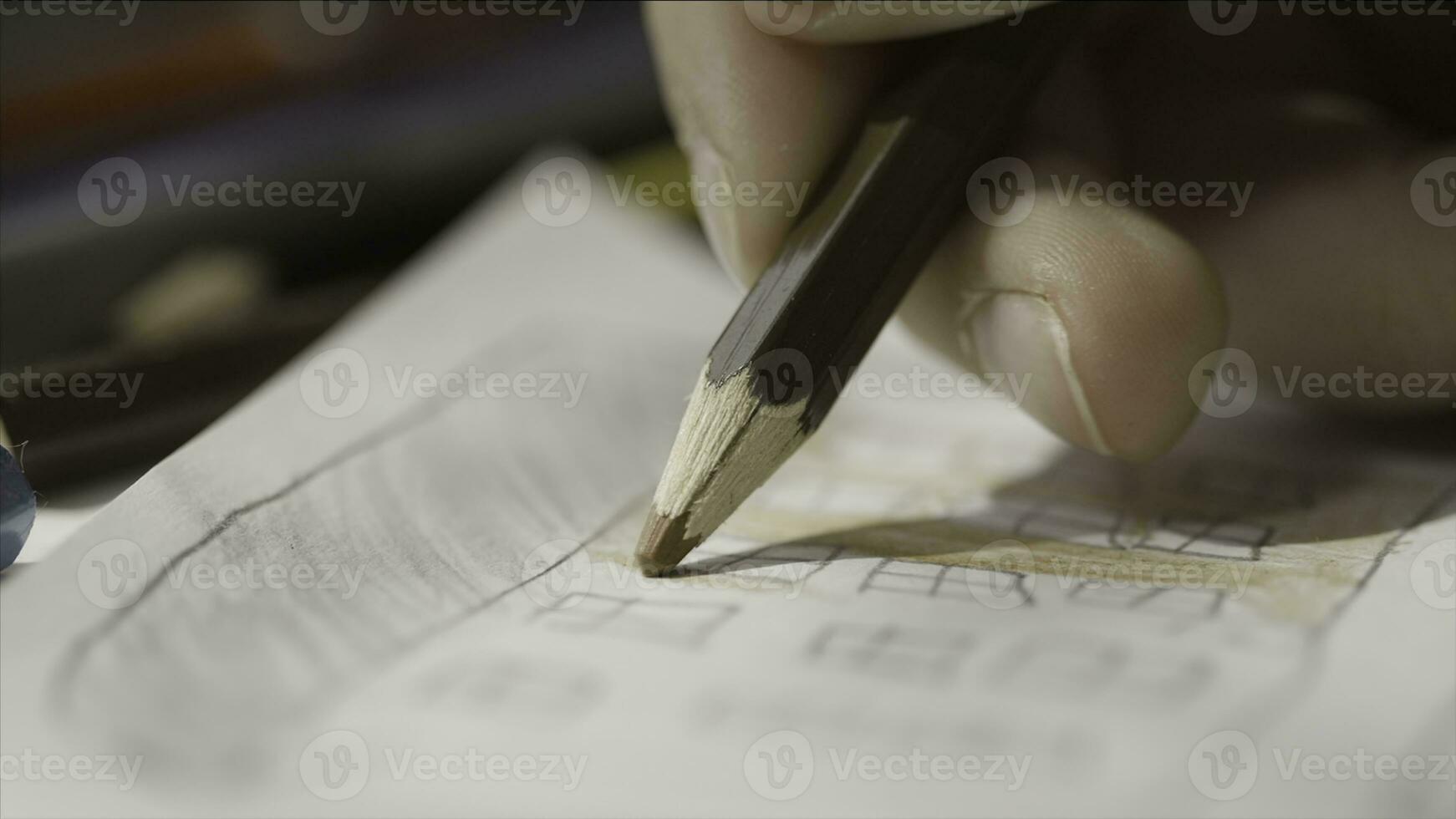 Close up hand of child while drawing using a pencil. Close up of kid's hand paints using a color pencil. Painting with a pencil macro shoot photo