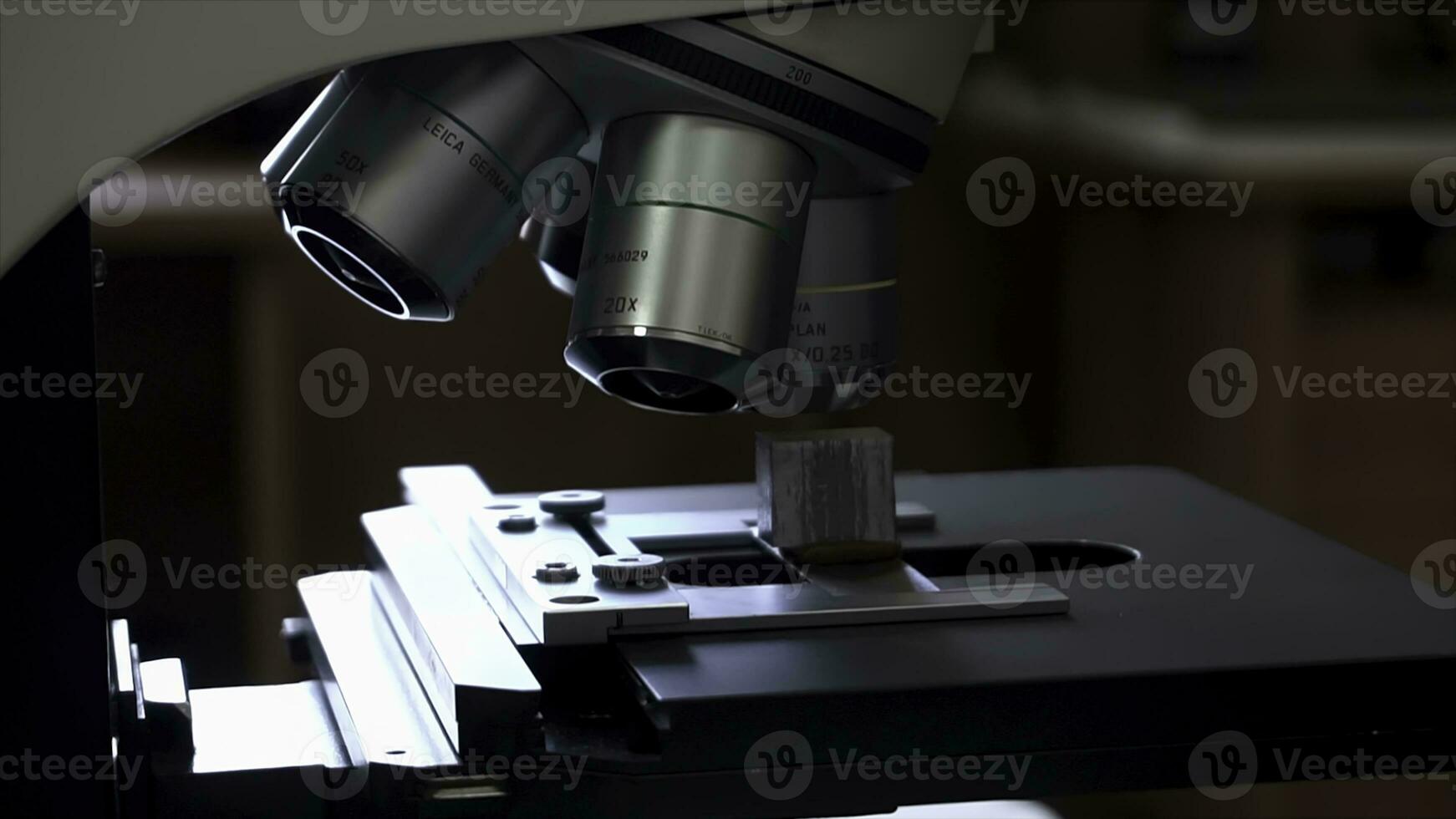 Close up for the microscope lens, science concept. Footage. Microscope standing on the table, scientific equipment. photo