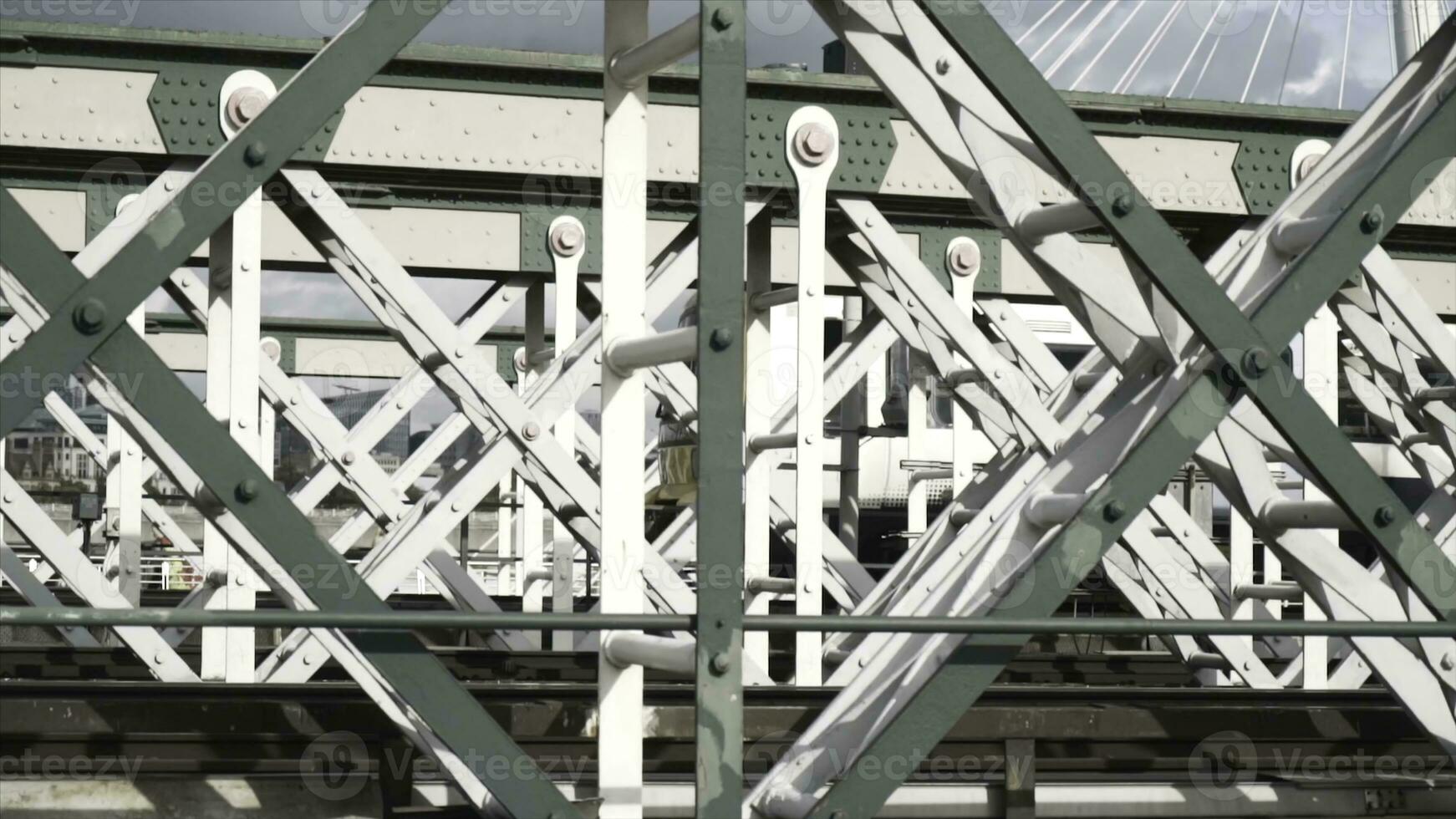 Close-up view of the white wagon going rapidly on the bridge against the blue sky. Action. Urban rail transport photo