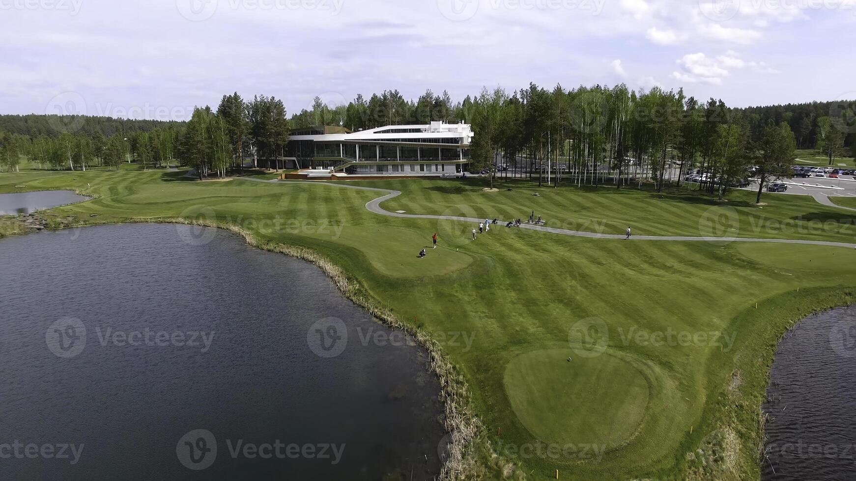 Solar Golf cart with clouds on blue sky and forest lake Golf club, aerial photo