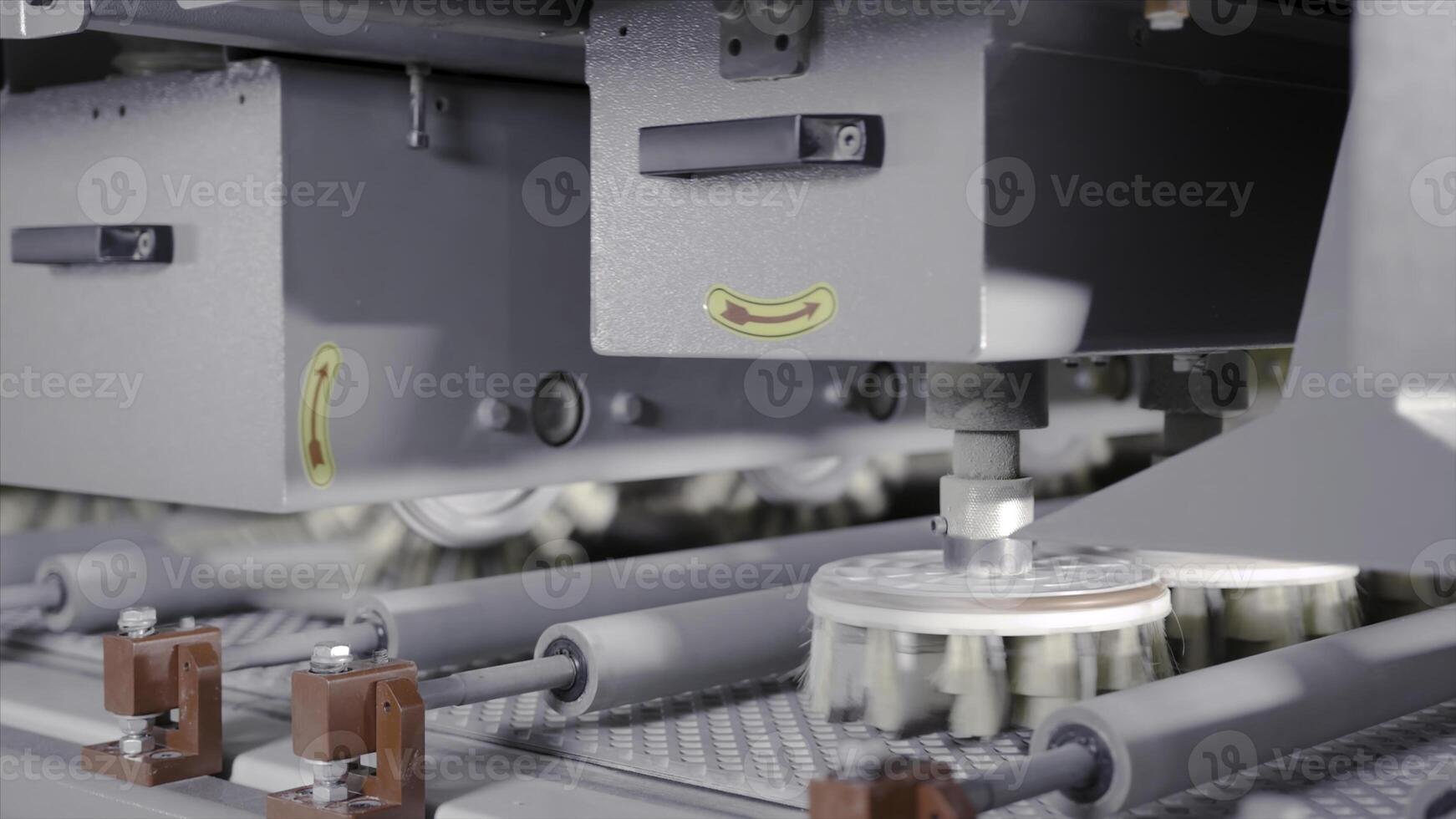Brushes in industrial production. Action. Automated machines with bristly nozzles for cleaning and painting. Rotating brushes on industrial machines for processing wooden boards photo