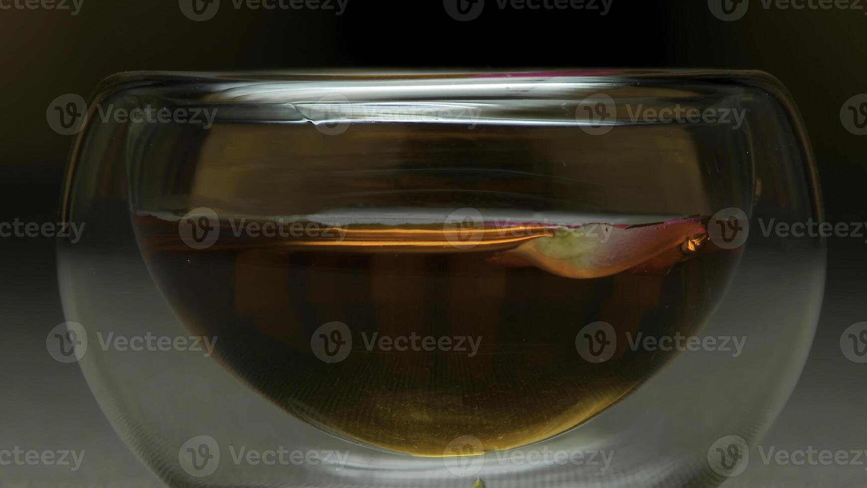 Close up cup of tea and mint on a wooden background. Glass of hot tea close up. Bowl of Chinese tea extreme close up photo