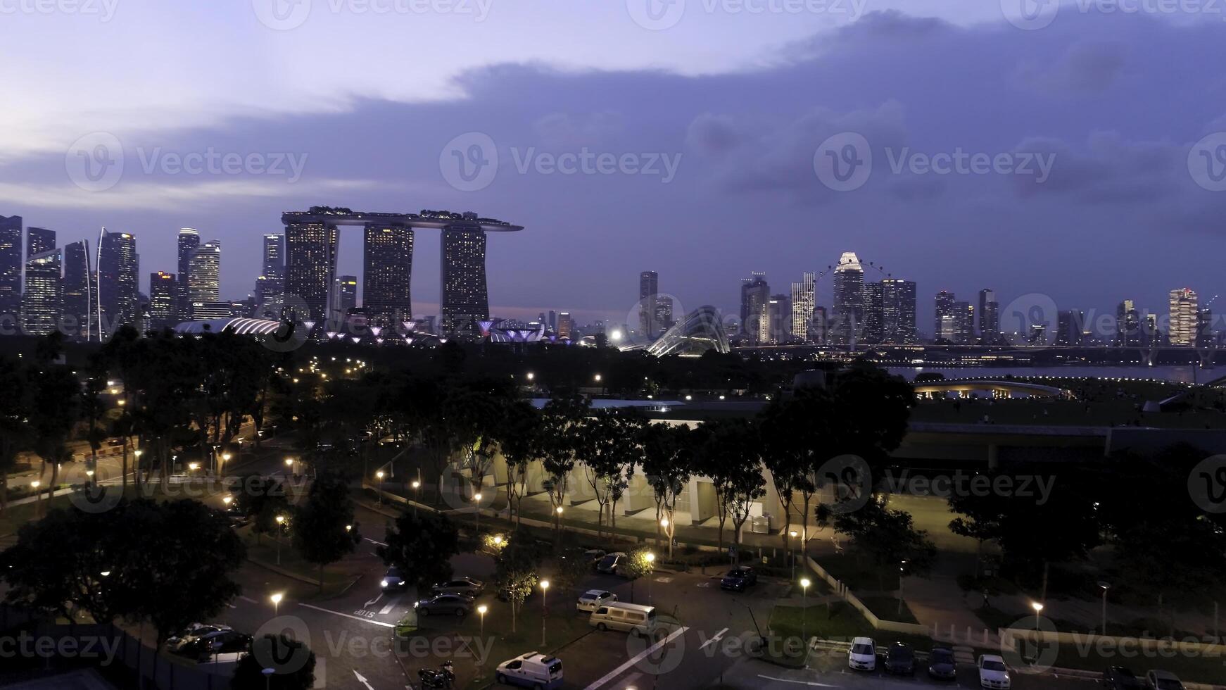Top view of cityscape at Sand Sky Park Singapore at twilight time. Shot. Top view of Singapore in the evening photo