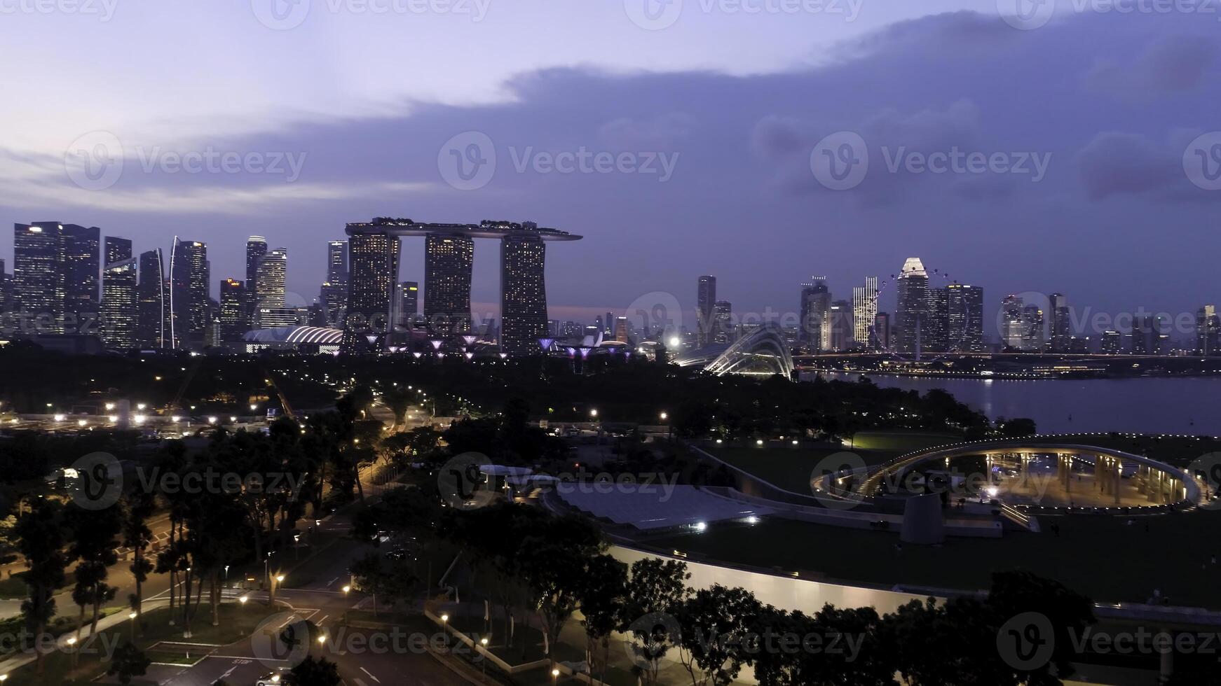 Top view of cityscape at Sand Sky Park Singapore at twilight time. Shot. Top view of Singapore in the evening photo