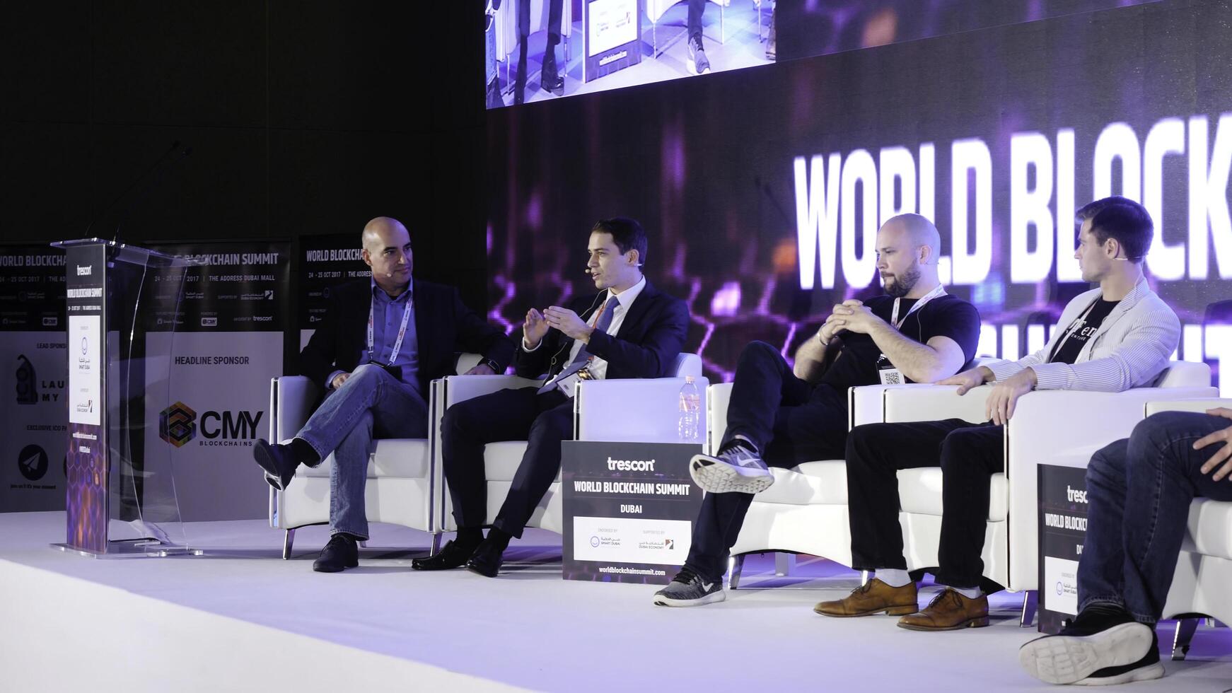 United Arab Emirates, Dubai - October 2017. Business Meeting and Conferences Ideas. Group of People Attending Conference and Listening to the Host Speakers On Stage. Conference in Dubai on blockchain photo