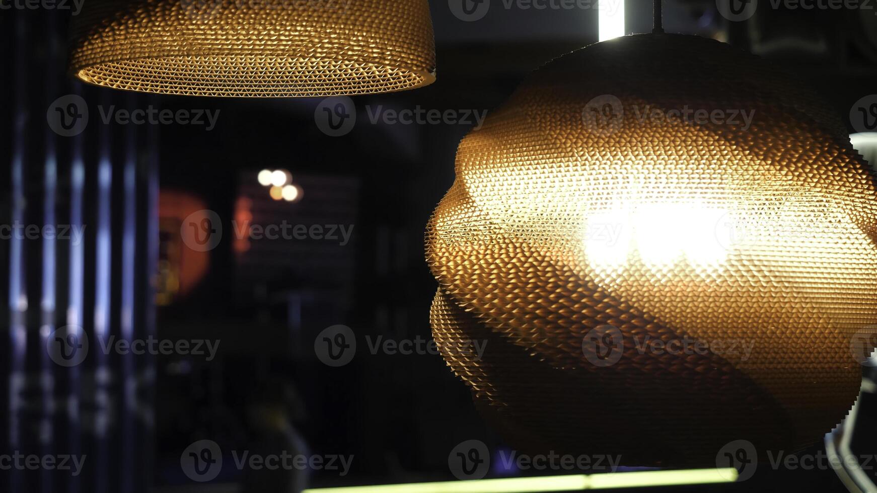 Warm lighting coming out from beautiful lamps while taking a hot cup of coffee in a trendy cafe with nice environment photo