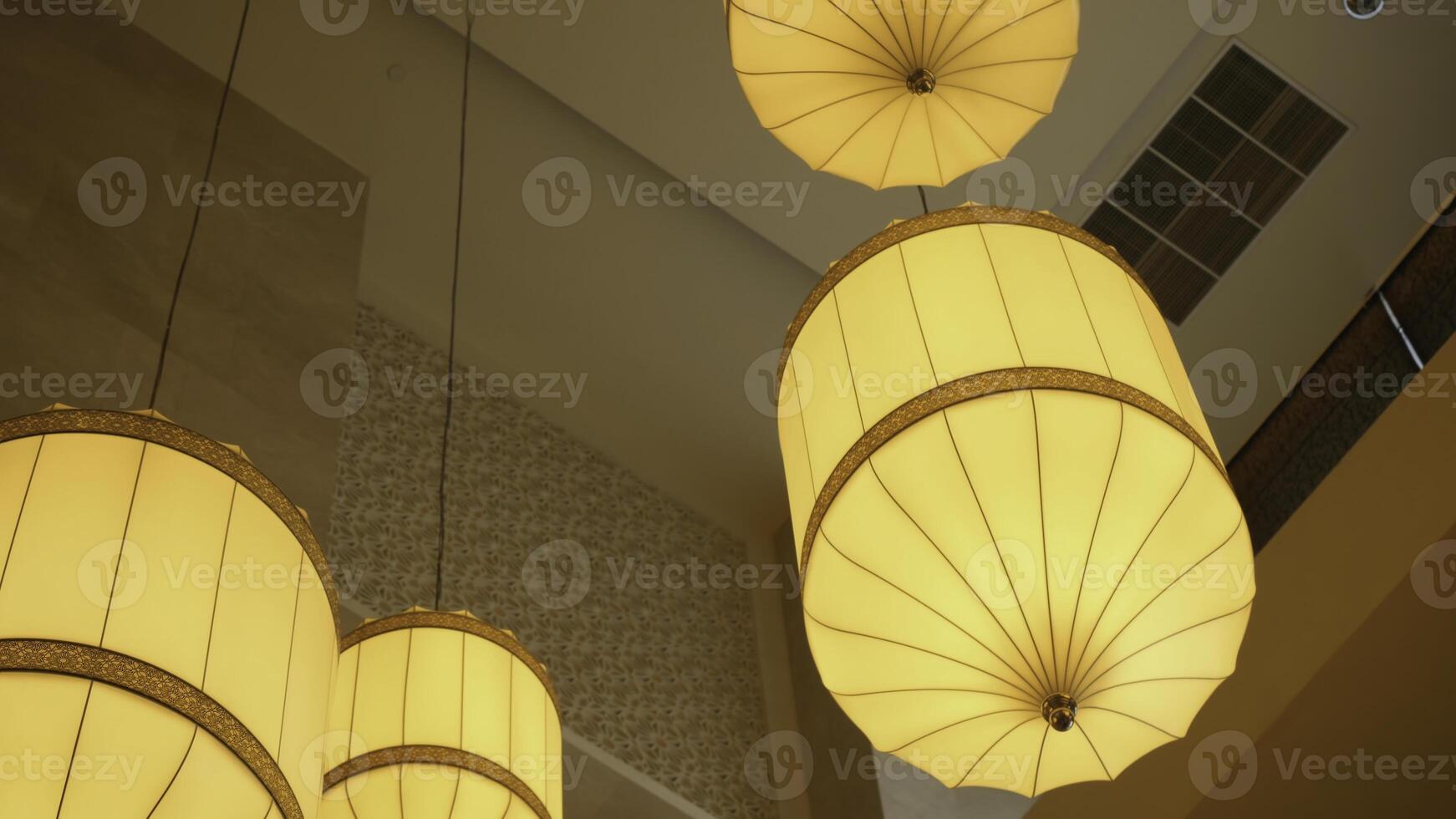 Beautiful chandelier. Luxury expensive chandelier hanging under ceiling. Beautiful luxury expensive chandelier hanging under ceiling in hotel photo