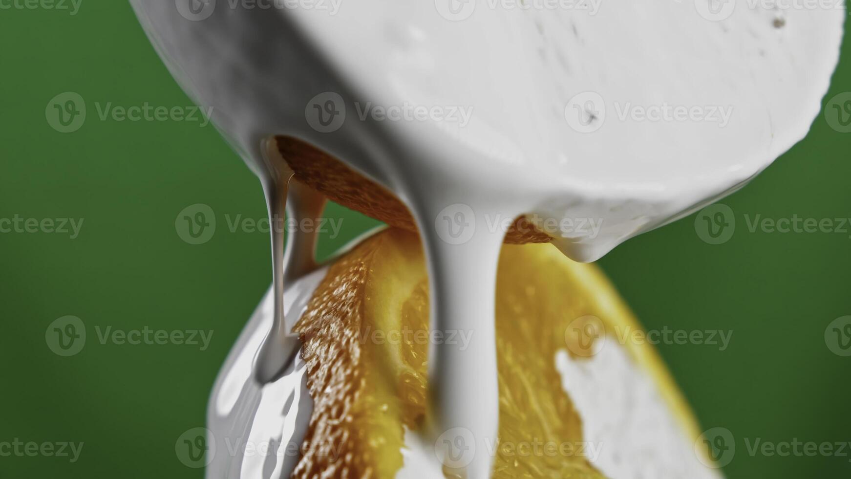 Dessert kitchen concept on a green background. Stock clip. Oranges and sweet butter cookies doused with white sweet custard. photo