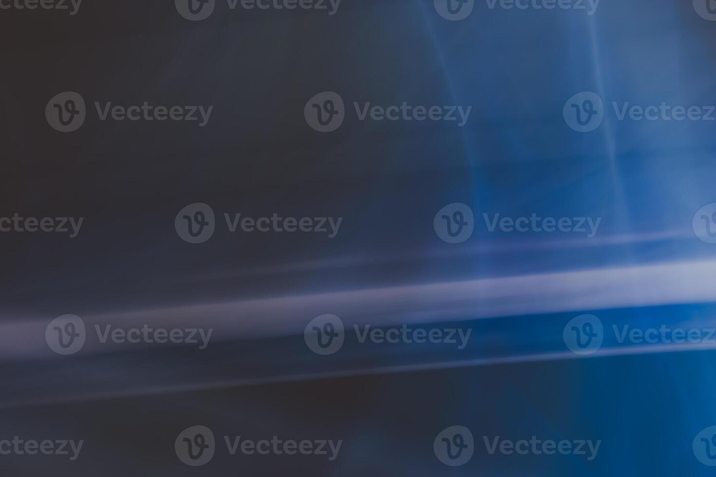 Abstract horizontal background in dark blue tones with a gradient, defocused lights and shadow, highlights. Design element. photo