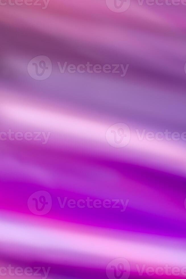 Abstract vertical background with smooth horizontal lines in waves of purple and pink colors with a gradient. photo