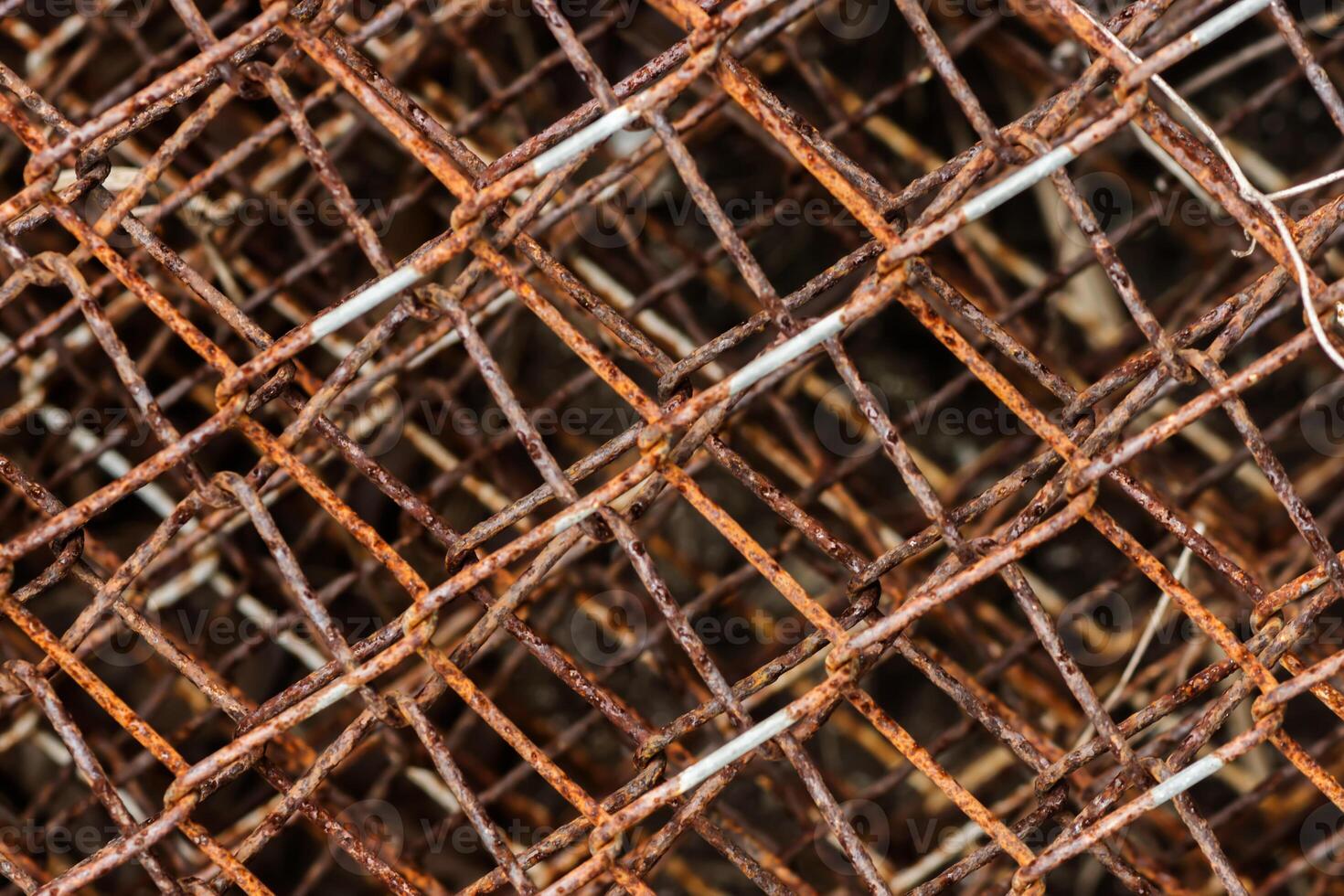 Old wire fence full of rust. photo