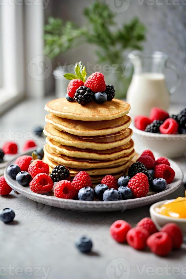 AI generated A delicious stack of pancakes topped with fresh berries and blueberries photo