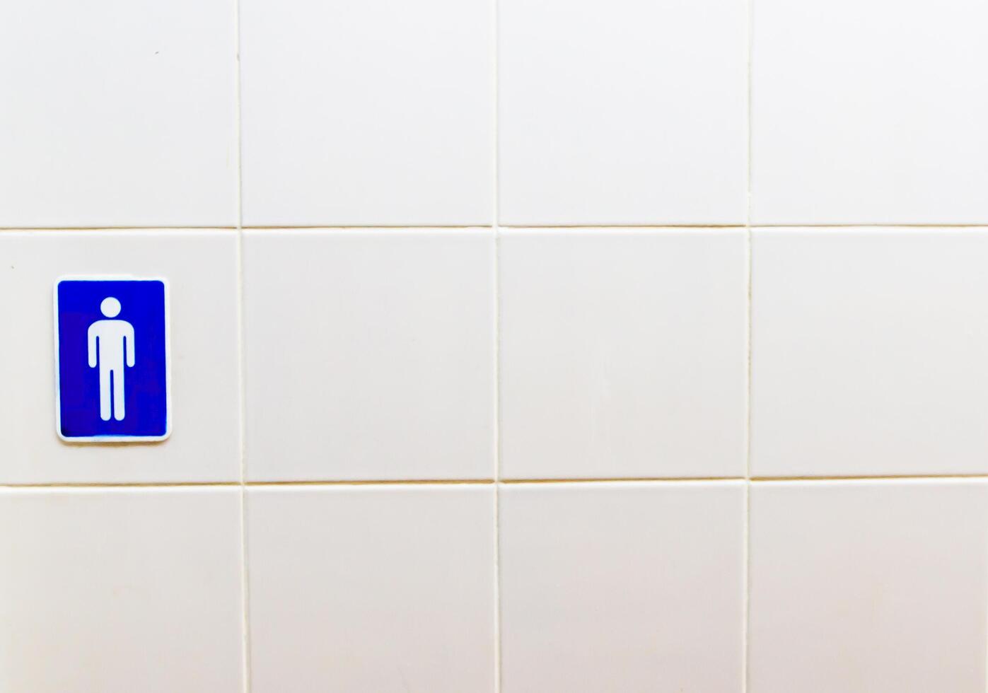 Restroom Men's Toilet signs on brick wall photo