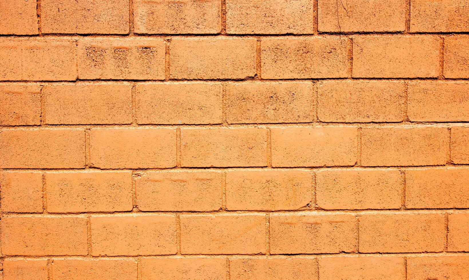 Brick wall or red brick dark tone of color for background texture photo